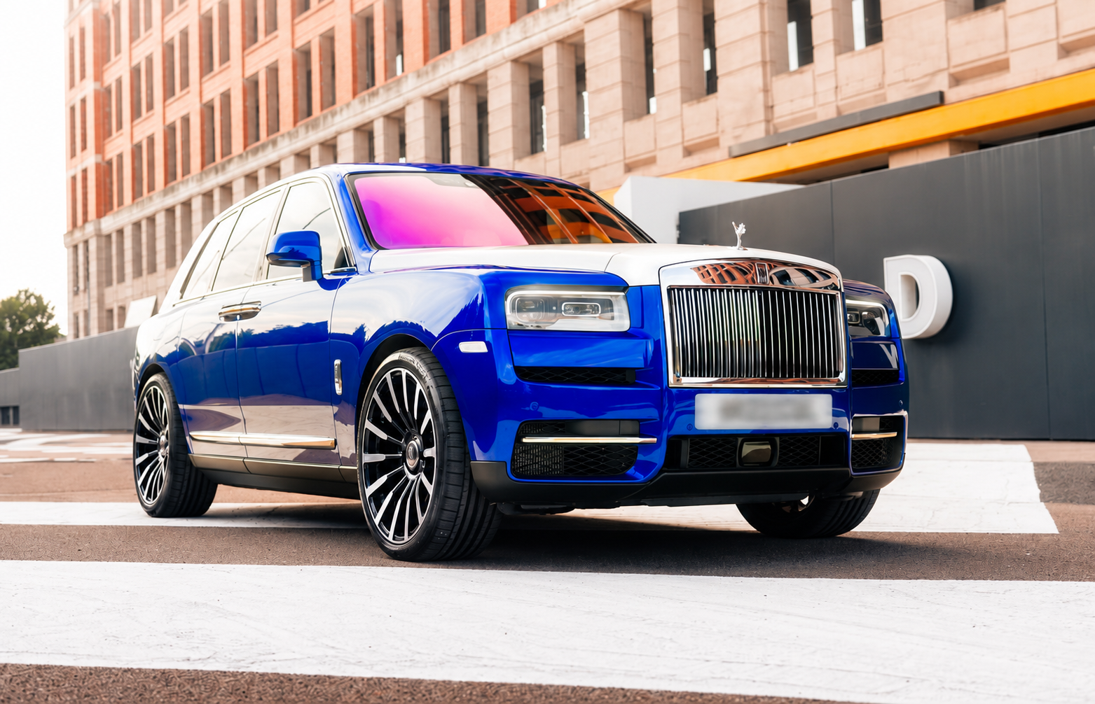 Blue Luxury SUV in Urban Light