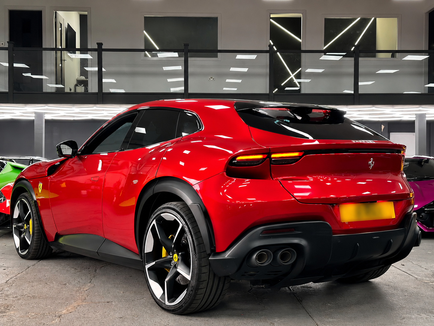 Polished Red Ferrari SUV in LED Showroom